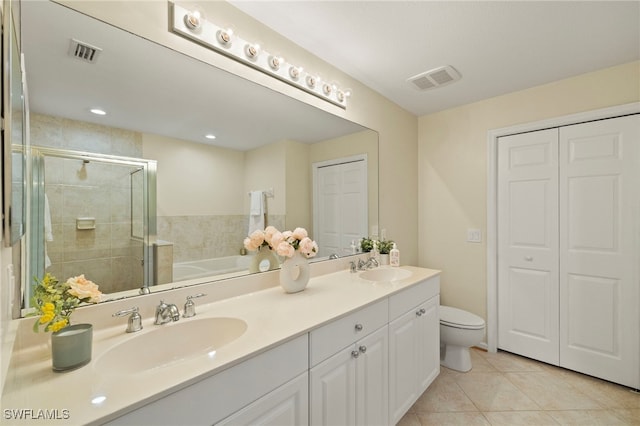 full bathroom with toilet, vanity, shower with separate bathtub, and tile patterned flooring