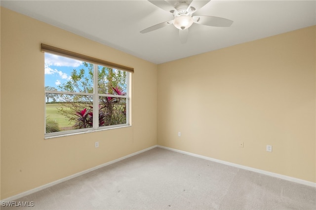 carpeted empty room with ceiling fan