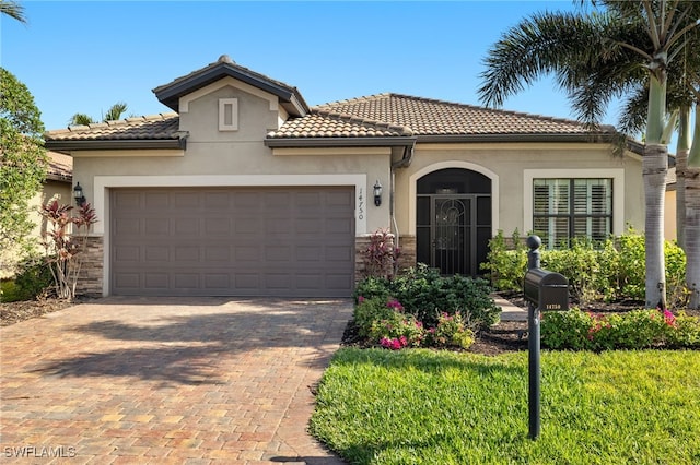 mediterranean / spanish-style home featuring a garage