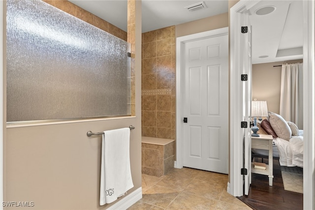 bathroom featuring tile patterned floors and walk in shower