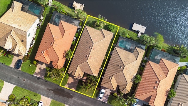 birds eye view of property featuring a water view