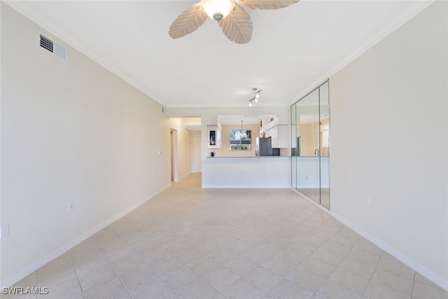 unfurnished living room with ceiling fan, light tile patterned flooring, and ornamental molding