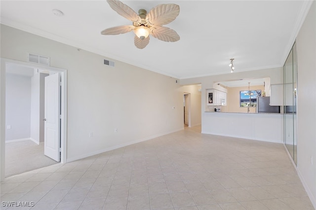 unfurnished living room featuring ceiling fan, light tile patterned flooring, and ornamental molding