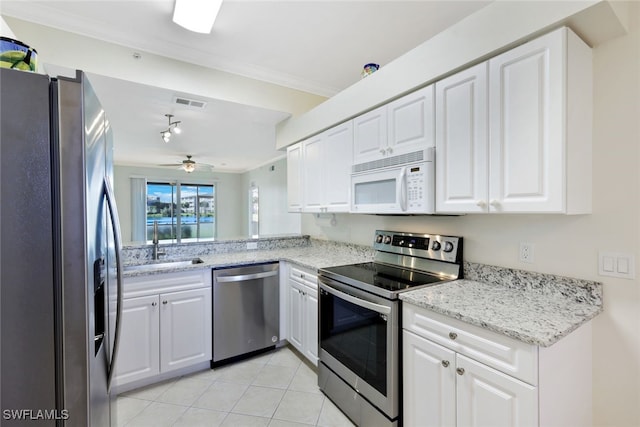 kitchen featuring white cabinets, appliances with stainless steel finishes, and ceiling fan