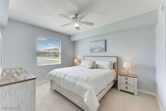 16635 Lake Circle Dr Unit 614, Fort Myers, FL 33908 - bedroom with light carpet, baseboards, and ceiling fan