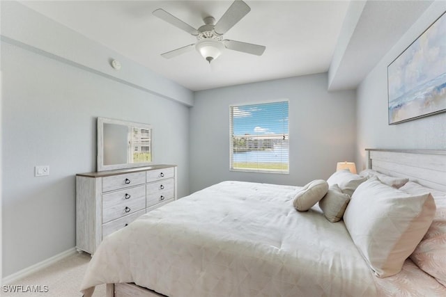 16635 Lake Circle Dr Unit 614, Fort Myers, FL 33908 - bedroom featuring baseboards, light colored carpet, and a ceiling fan