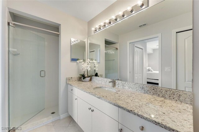 16635 Lake Circle Dr Unit 614, Fort Myers, FL 33908 - ensuite bathroom with a stall shower, tile patterned flooring, and vanity