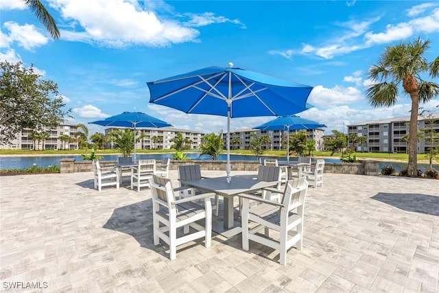 16635 Lake Circle Dr Unit 614, Fort Myers, FL 33908 - view of patio / terrace with outdoor dining space and a water view