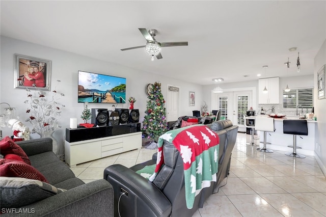 tiled living room featuring ceiling fan