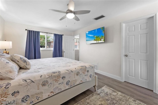 bedroom featuring ceiling fan and dark hardwood / wood-style flooring