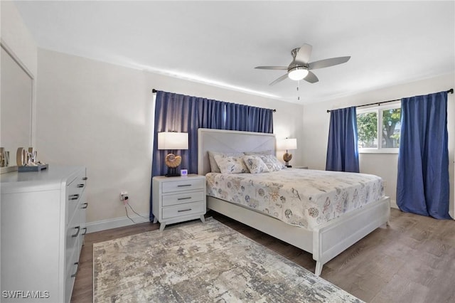 bedroom featuring hardwood / wood-style flooring and ceiling fan