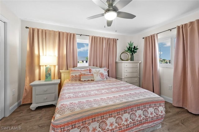 bedroom with ceiling fan and dark hardwood / wood-style flooring