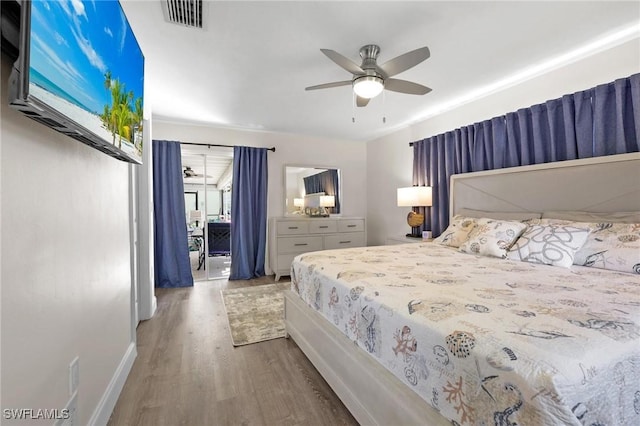 bedroom featuring ceiling fan and hardwood / wood-style floors