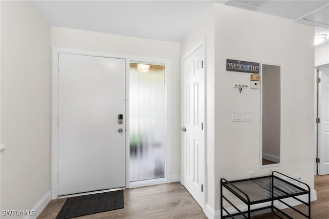 entrance foyer with light hardwood / wood-style flooring