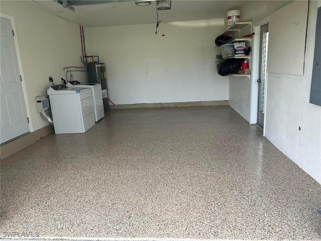 garage with water heater and washer and dryer