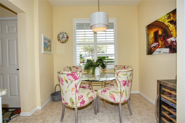 dining area with wine cooler and light tile patterned flooring