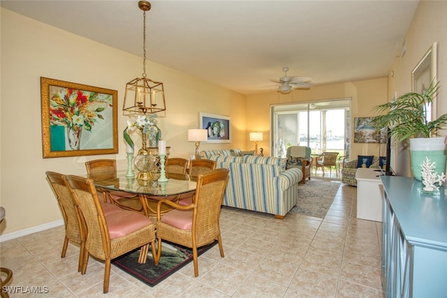 tiled dining room with ceiling fan