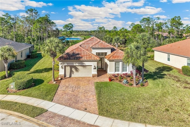 view of front of home with a garage and a front lawn