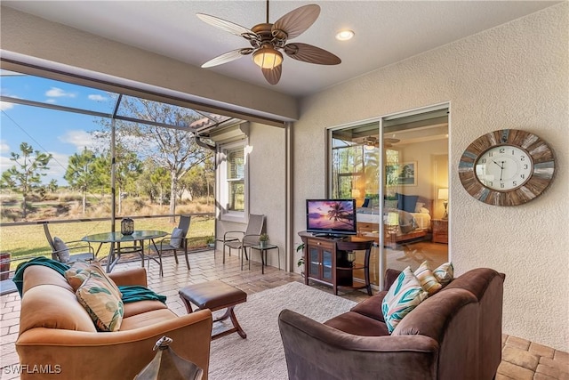 sunroom / solarium with ceiling fan