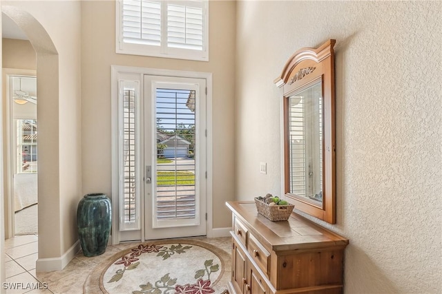 foyer featuring light tile patterned flooring