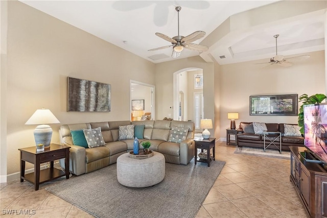 tiled living room featuring ceiling fan