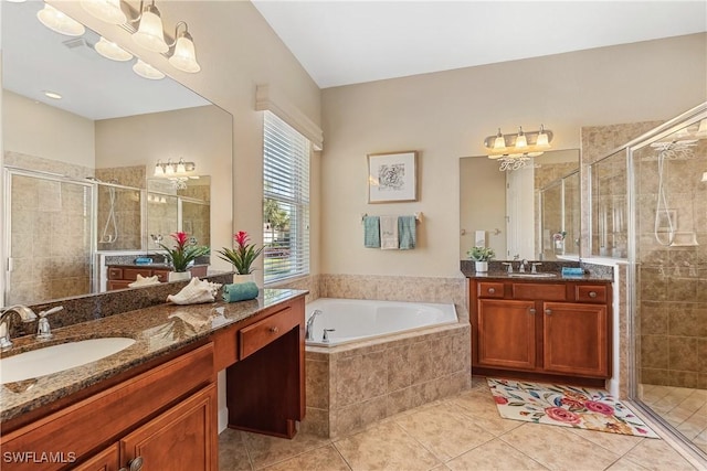 bathroom with shower with separate bathtub, vanity, an inviting chandelier, and tile patterned floors