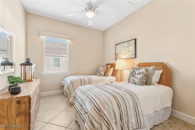 tiled bedroom with ceiling fan