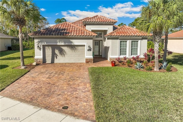 mediterranean / spanish-style house with a front lawn and a garage