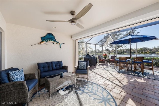 view of patio featuring an outdoor living space, a water view, area for grilling, and a lanai