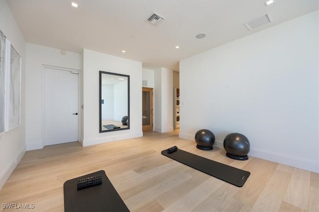 exercise area featuring light hardwood / wood-style floors