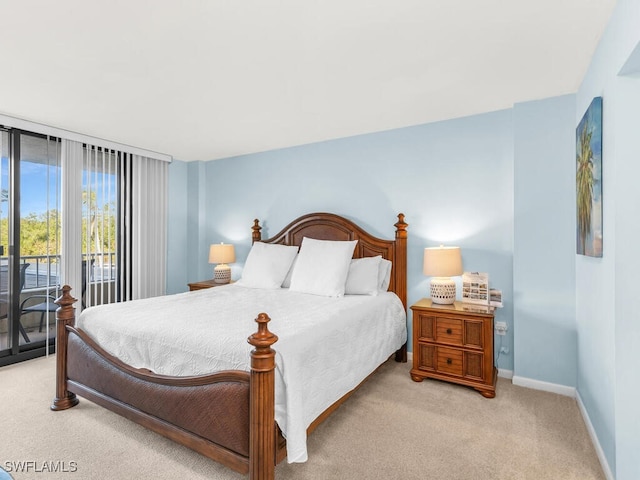 bedroom featuring light colored carpet