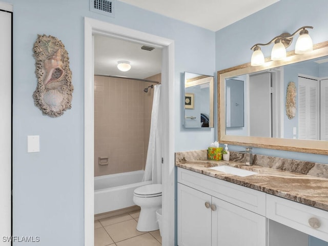 full bathroom with tile patterned floors, vanity, shower / bath combo, and toilet