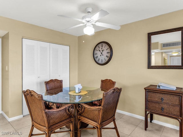 dining area with ceiling fan and light tile patterned flooring