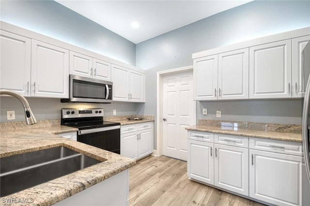 kitchen with white cabinetry, sink, and appliances with stainless steel finishes