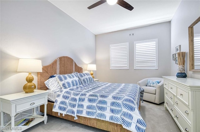 carpeted bedroom featuring ceiling fan and lofted ceiling