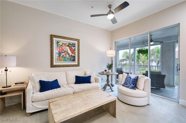 carpeted living room featuring ceiling fan