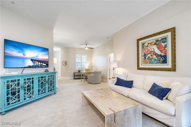 living room featuring ceiling fan and carpet floors