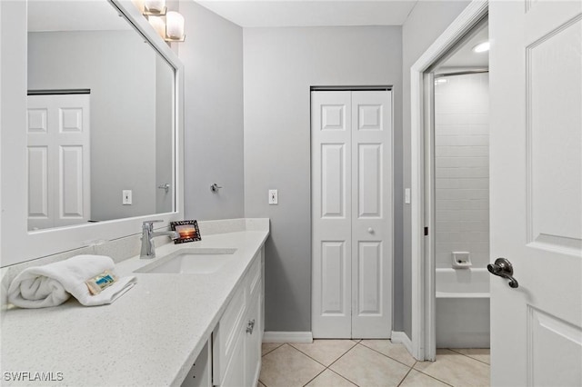 bathroom with tile patterned flooring and vanity