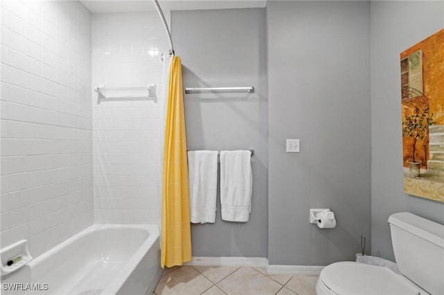 bathroom featuring tile patterned floors, shower / tub combo, and toilet