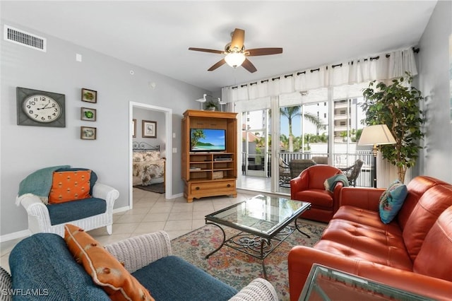 living room featuring ceiling fan and light tile patterned floors