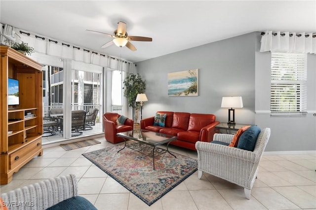 tiled living room featuring ceiling fan