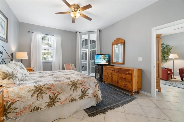 tiled bedroom with access to outside and ceiling fan