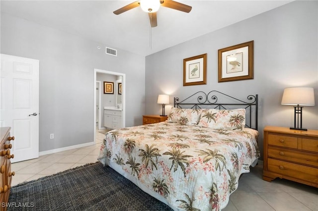 tiled bedroom with ceiling fan and connected bathroom