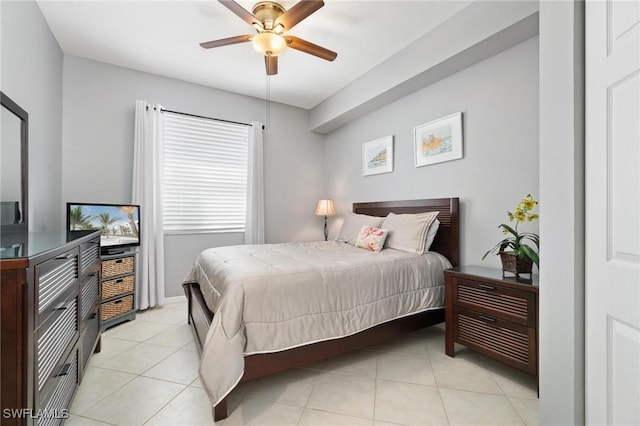 bedroom featuring ceiling fan and light tile patterned flooring