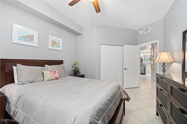 tiled bedroom featuring a closet and ceiling fan