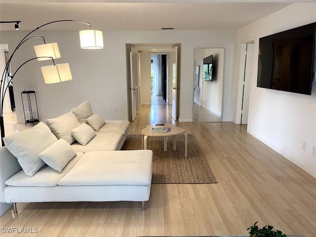 living room with light hardwood / wood-style flooring