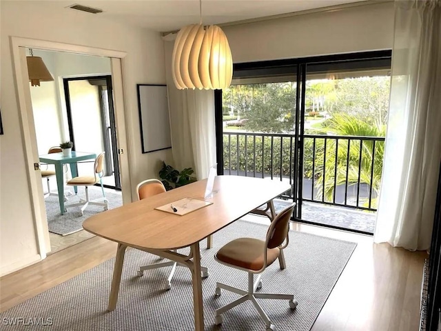 dining space featuring light wood-type flooring