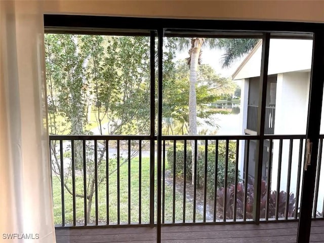 doorway to outside with a water view