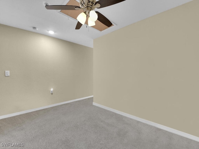 unfurnished room featuring light carpet and ceiling fan