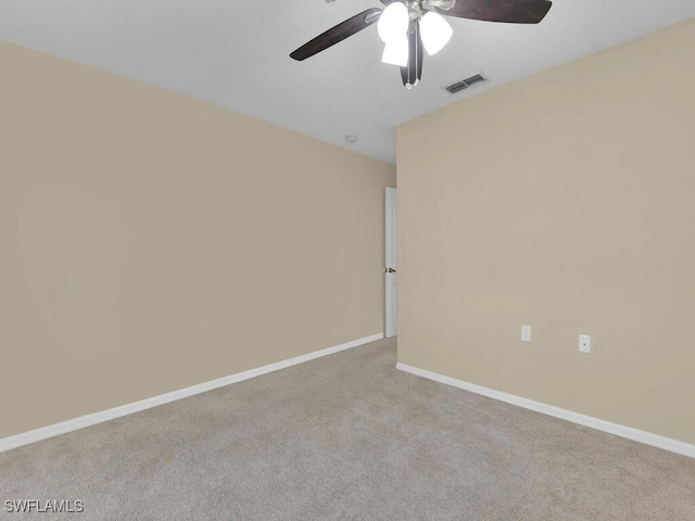 carpeted empty room with ceiling fan